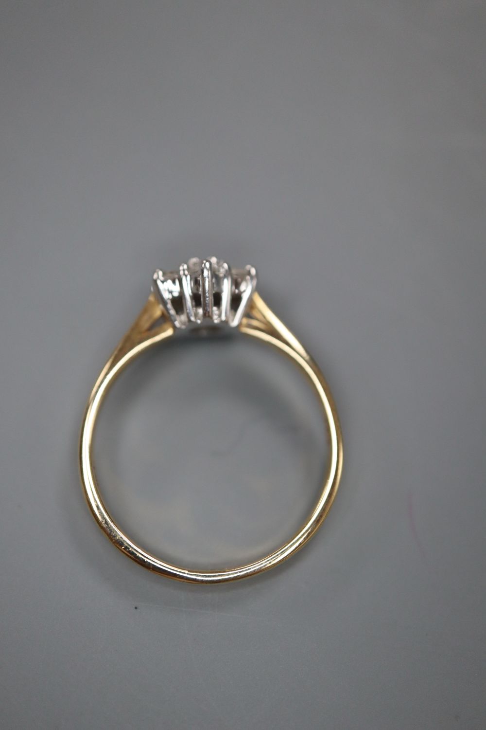 A modern 9ct gold and diamond cluster flower head ring, size J, gross 1.6 grams.